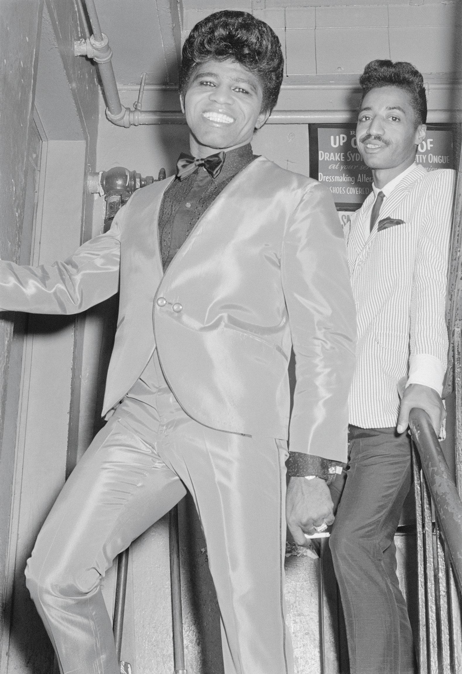 James Brown and his cape man Danny Ray backstage at the Apollo Theater, 1964. Photo by Don Paulsen via Michael Ochs Archives/Getty Images.